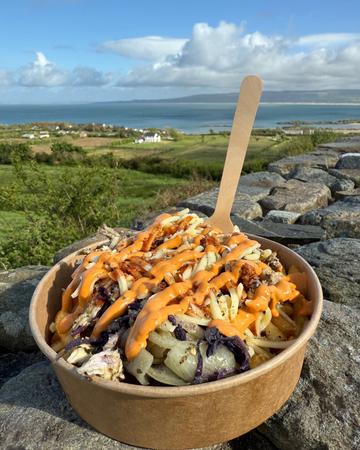 Loaded Fries in front of Ocean